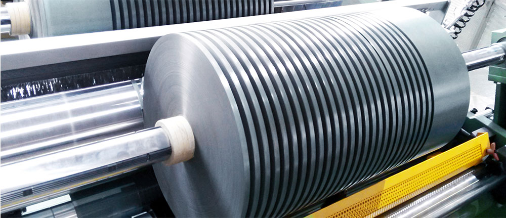 Slit mica tape rolls on paper cores, ready for transformer coil winding applications.